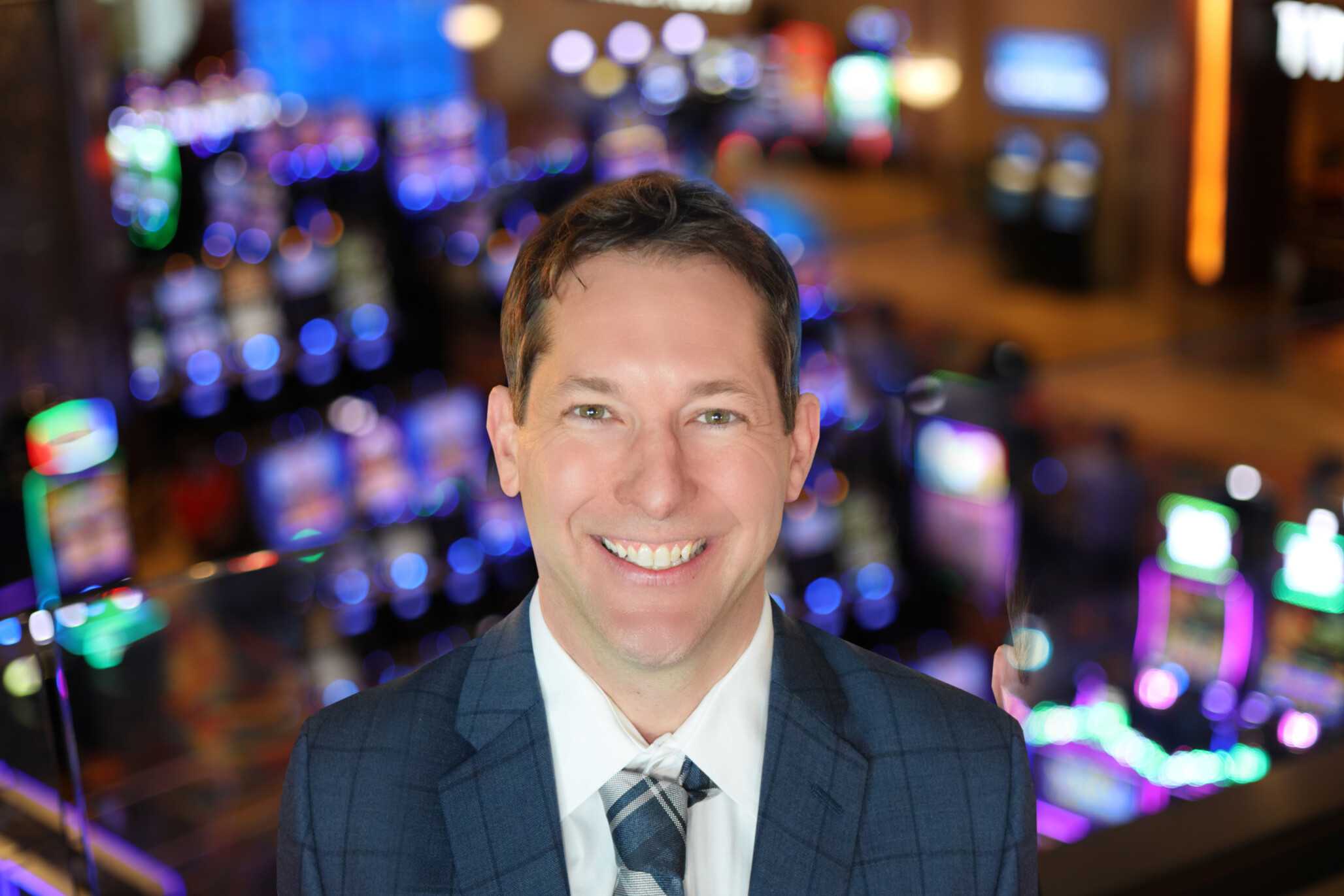 Benjamin Petell, Vice President of Non-Gaming Operations for Jamul Casino Resort, standing in front of the vibrant casino floor.