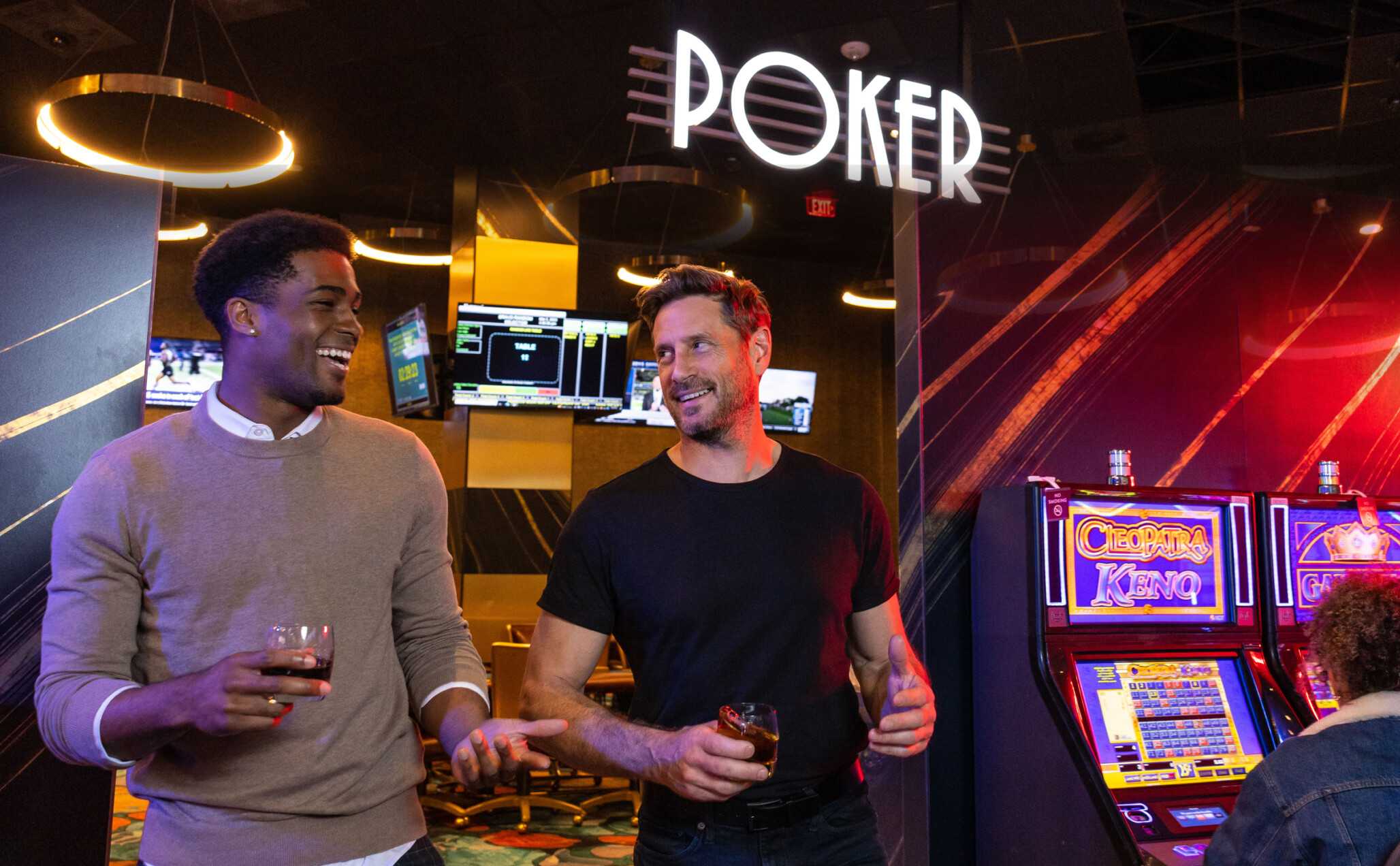 Young men have fun while playing in Jamul Casino Resort's poker room.